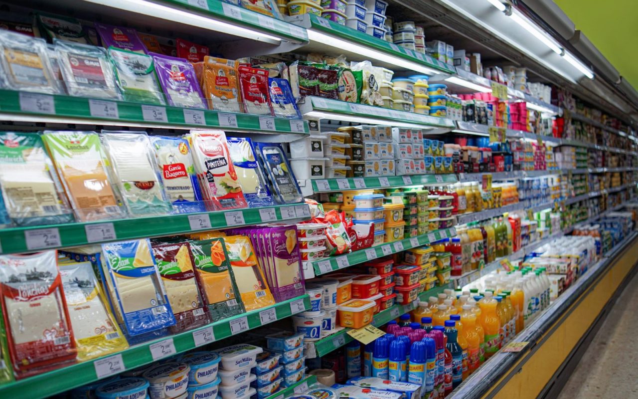 Supermarket aisle with stocked shelves