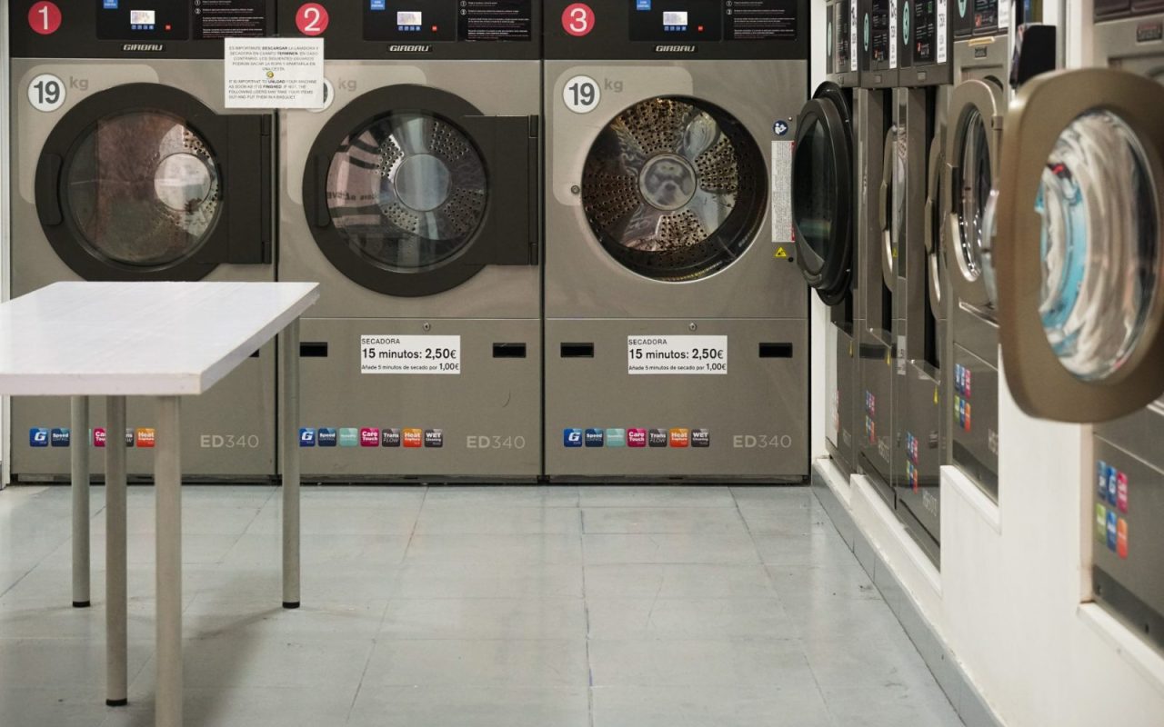 Row of washing machines in a laundromat